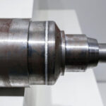 High-precision laser welding machine performing a weld on metal components.