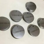 Laser marking machine creating intricate designs on electronic components.